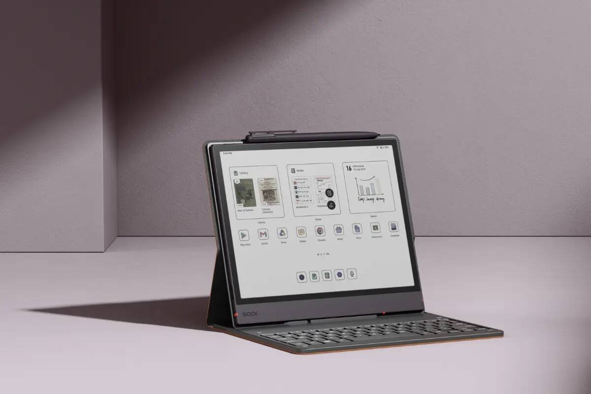 2-in-1 tablet with attached keyboard and stylus resting on a purple desk surface.
